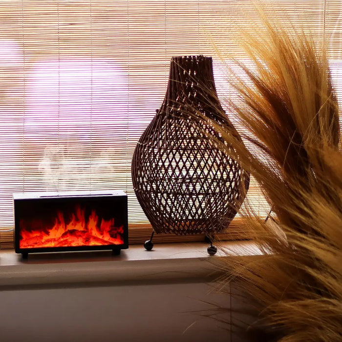 A black usb powered electric flame effect aroma diffuser with two mist settings and gentle bird sound