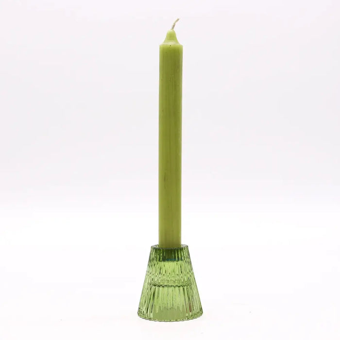 A slender olive green candle stands upright in a matching textured glass holder for candles in garden jade style