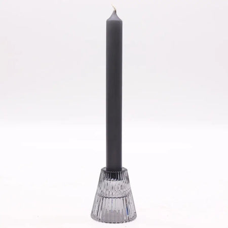 A matte black flip dinner candle stands in a clear faceted glass tealight holder with vertical ridges candles design