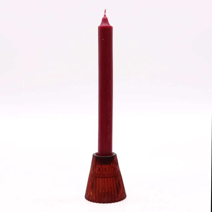 A tall deep red flip dinner candle with a textured fluted glass tealight holder base for candles display