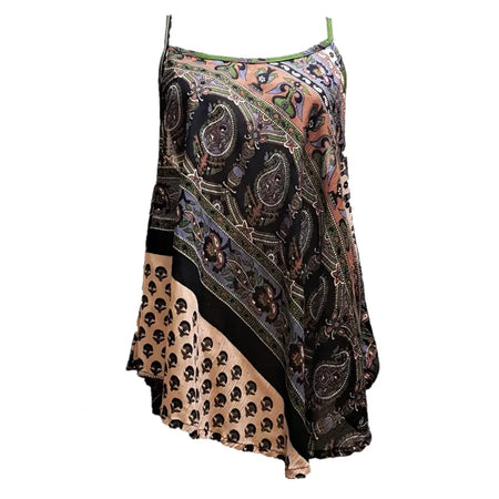 A flowing asymmetrical camisole top with vibrant indian print skull design and green spaghetti straps
