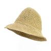 Beige woven straw sun hat with wide floppy brim and textured crochet pattern natural floppy straw sun hat