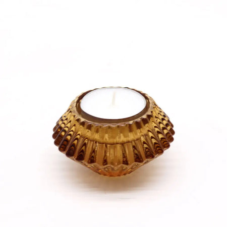 Amber-colored glass tea light holder with scalloped textured design for candles in antique amber finish
