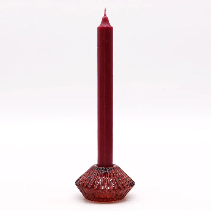 A tall deep red flower flip dinner candle with a textured glass base and tealight holder in vampire red color