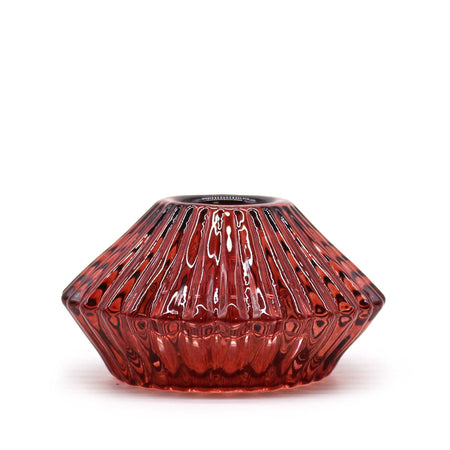 A vampire red faceted glass flower flip dinner candle holder with glossy finish and vertical ridges for tealights
