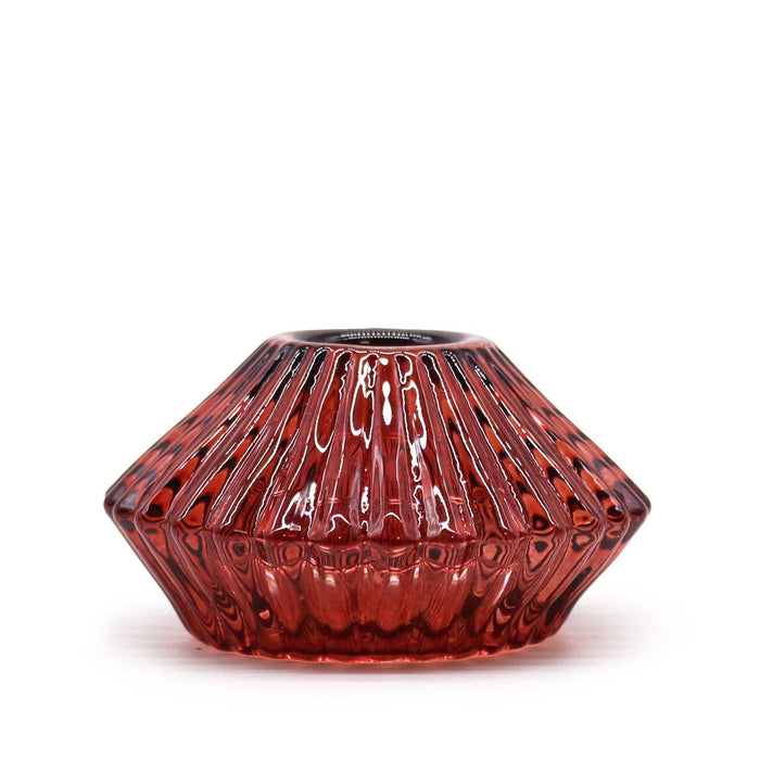 A vampire red faceted glass flower flip dinner candle holder with glossy finish and vertical ridges for tealights