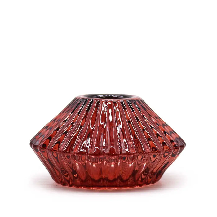 A vampire red faceted glass flower flip dinner candle holder with glossy finish and vertical ridges for tealights