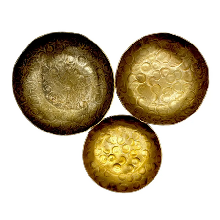Set of three hammered brass bowls with forged antique finished warm golden color and textured circular indentations