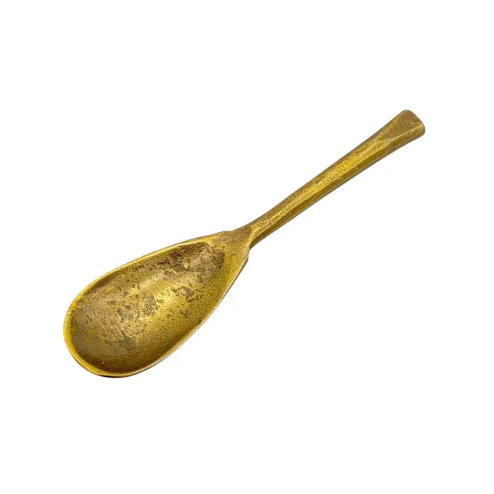 A brass forged antique finished oval spoon with a worn textured finish and simple elegant design in three sizes