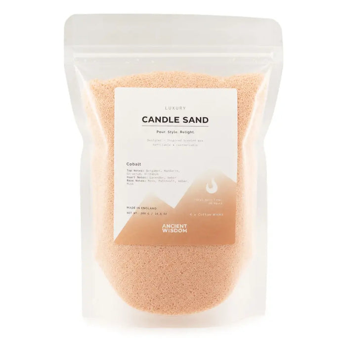 A clear resealable pouch of peach-colored cobalt candle sand with a minimalist white and orange label showing 300g weight