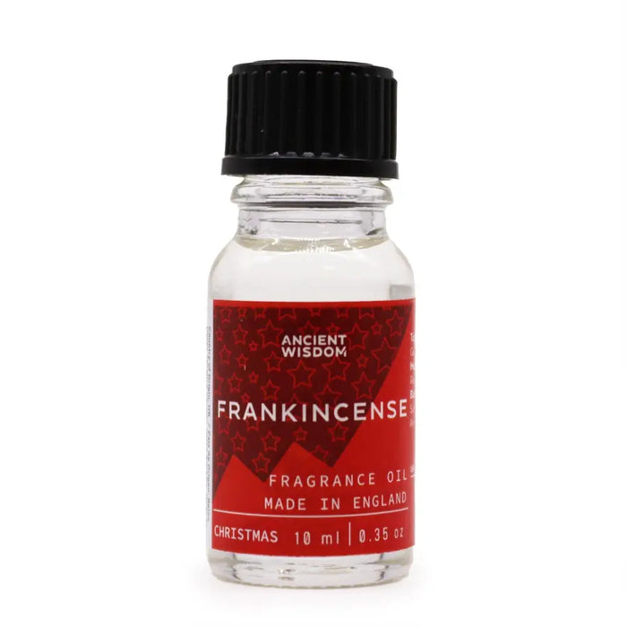 A clear glass bottle with black ribbed cap and red label holding frankincense christmas fragrance oil 10ml with allergen declarations