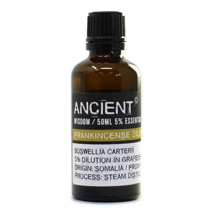 A dark amber glass bottle with black cap containing 50ml frankincense essential oil boswellia carterii with allergen info