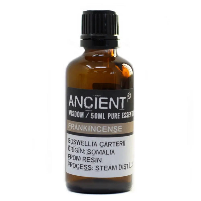 A 50ml amber glass bottle of frankincense essential oil with black cap and somalia origin label showing boswellia carterii allergen declarations