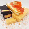 Vibrant orange and cream marbled fruity handmade soap slices with a glossy translucent finish in a choice of fragrances