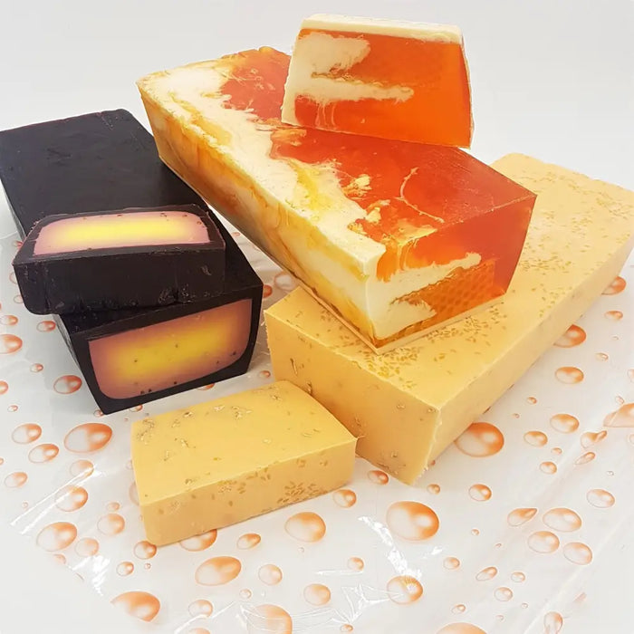 Vibrant orange and cream marbled fruity handmade soap slices with a glossy translucent finish in a choice of fragrances