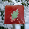 Red square glass ornament with green holly leaf and pink berries for funky handmade soap slice christmas themes