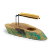 Rustic gamal wood palo santo heater with teal and natural wood finish on black metal stand holding smoldering incense stick