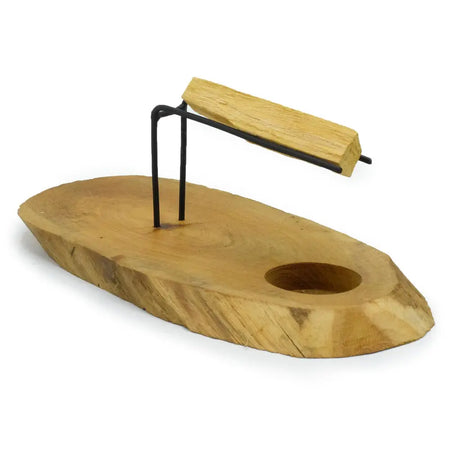Natural gamal wood palo santo heater board with black metal stand and circular cutout for holding sticks