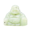 A smooth pale green jade buddha carving with subtle dark inclusions showing a smiling figure