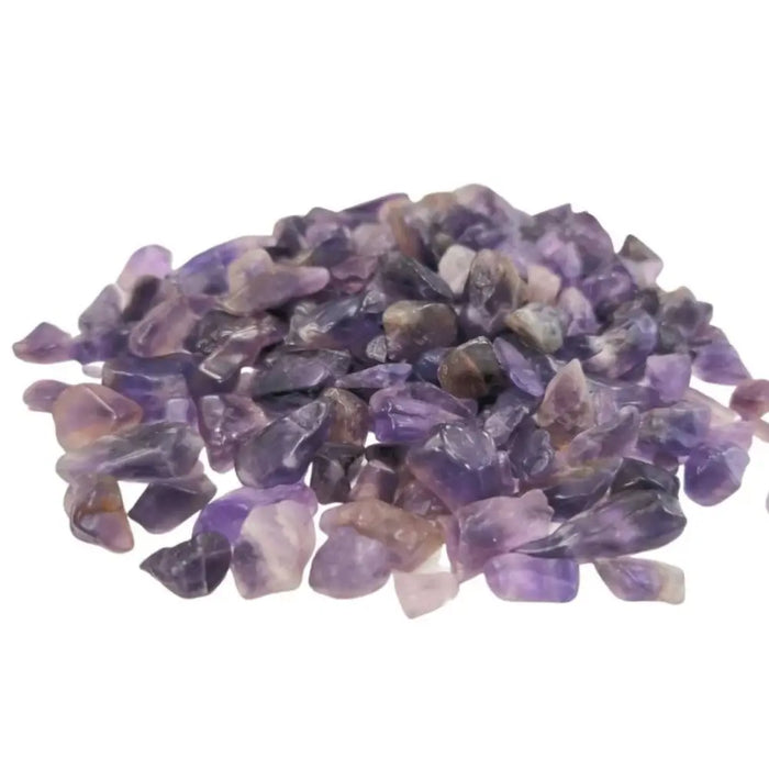 A pile of smooth faceted amethyst gemstone chips in shades of purple and lavender weighing 1kg