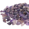 A pile of smooth translucent amethyst gemstone chips in shades of purple and lavender weighing 1kg