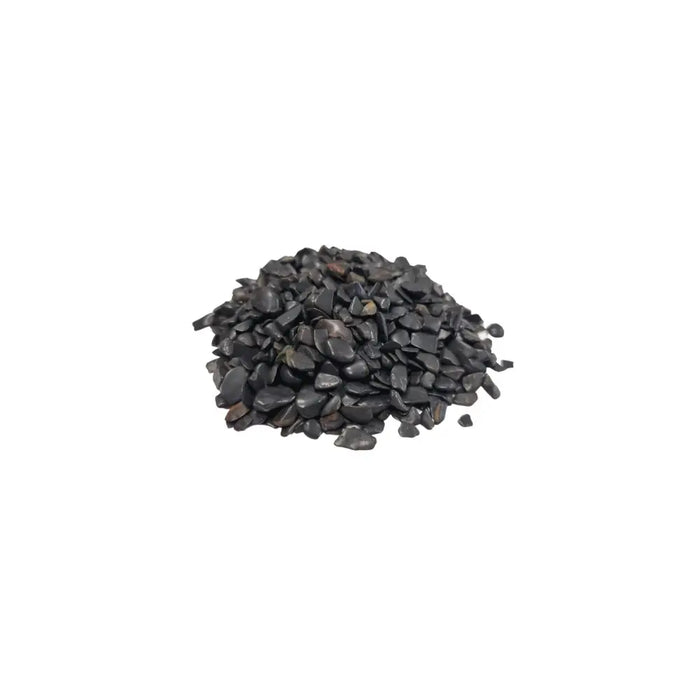 A pile of small black tourmaline gemstone chips with smooth polished surfaces in irregular shapes weighing 1kg
