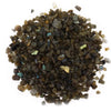 A pile of dark labradorite gemstone chips with blue and green iridescent flashes weighing 1kg
