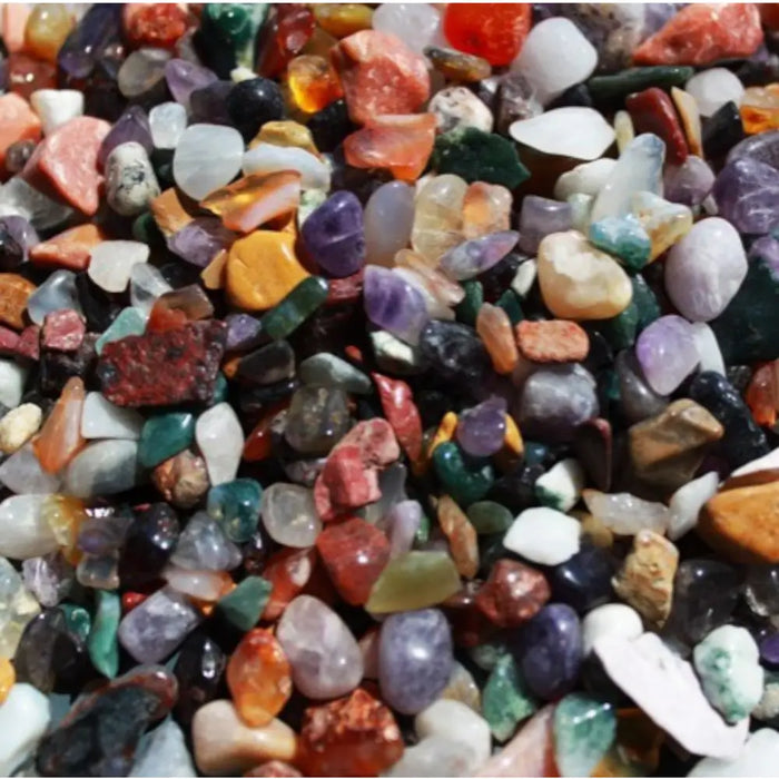 A vibrant mix of polished multicolored gemstone chips in various shapes and sizes weighing one kilogram natural stones
