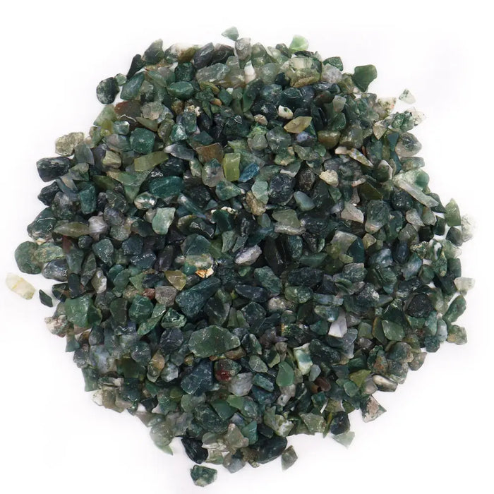 A pile of green and dark moss agate gemstone chips with mixed translucent and semi-translucent textures weighing 1kg