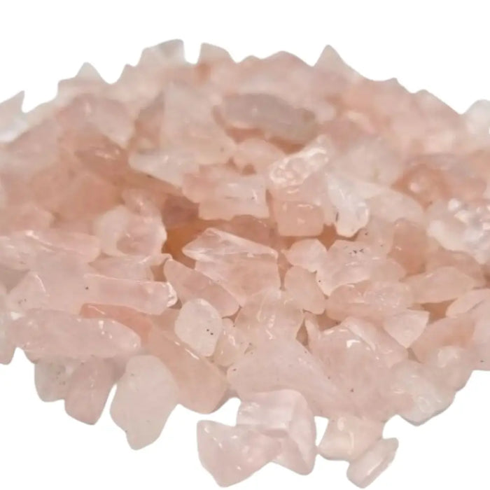 A pile of translucent pink rose quartz gemstone chips with jagged edges weighing 1kg