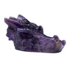 A polished purple amethyst dragon head carving with intricate details and a glossy finish