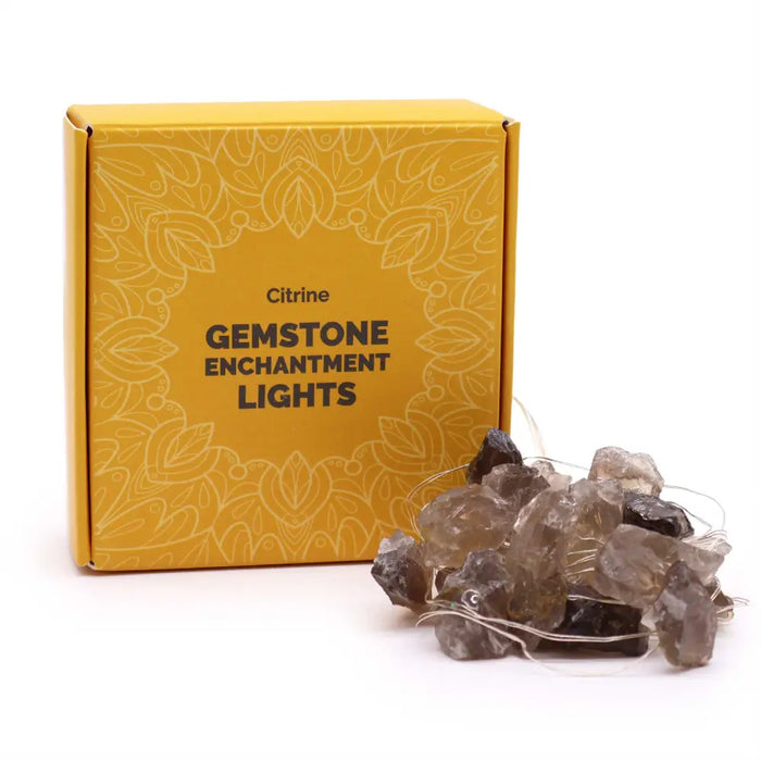 A string of citrine enchantment lights with rough-cut translucent amber and dark brown gemstone beads