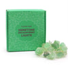 A string of translucent green crystal jade gemstone lights with a delicate wire design called gemstone enchantment lights