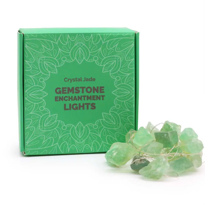 A string of translucent green crystal jade gemstone lights with a delicate wire design called gemstone enchantment lights