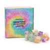 A string of enchantment lights with mixed rocks featuring translucent faceted gemstones in purple green orange and clear