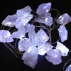 String of enchantment lights with translucent lavender rock quartz crystal pieces for soft decorative lighting