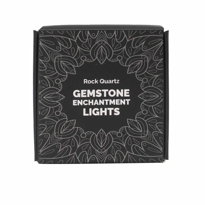 Black rectangular box with silver leaf design and white text showing rock quartz gemstone enchantment lights product name