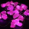Pink rose quartz crystal-shaped enchantment lights with a wire frame in a decorative string light design