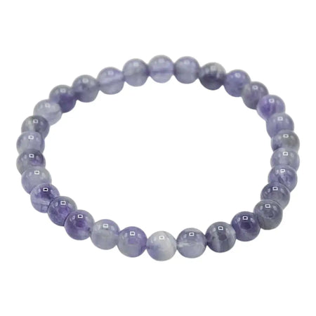 A delicate stretchy amethyst gemstone manifestation bracelet with smooth purple beads and subtle gray and white veins