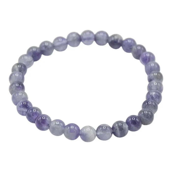 A delicate stretchy amethyst gemstone manifestation bracelet with smooth purple beads and subtle gray and white veins