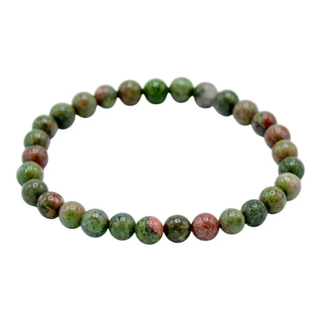 A beaded gemstone manifestation bracelet with polished green jasper and red marbled round beads for growth