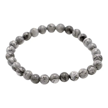 A sleek gemstone manifestation bracelet with stretchy gray and white marbled map stone beads
