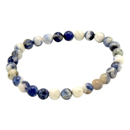 A gemstone manifestation bracelet made of stretchy sodalite beads in deep blue and creamy white with natural marbled patterns