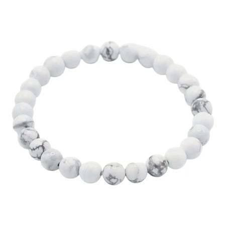 A white jasper gemstone manifestation bracelet with smooth white and gray marbled beads and a rounded design
