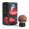 Red jasper gemstone planet sphere with orange brown gray bands on a dark blue speckled solar stand