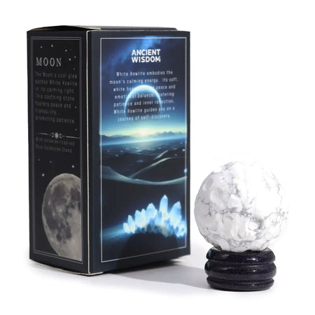 White howlite gemstone planet sphere with gray veining on a dark glittery solar stand base