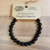 Black agate gemstone power bracelet with smooth polished spherical beads for mood and energy balance