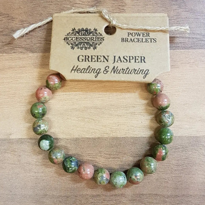 A green and pinkish green jasper gemstone bracelet with smooth rounded beads for mood and stone power wear