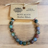 A colorful moss agate gemstone bracelet with round polished beads in green blue brown and purple for mood stone use