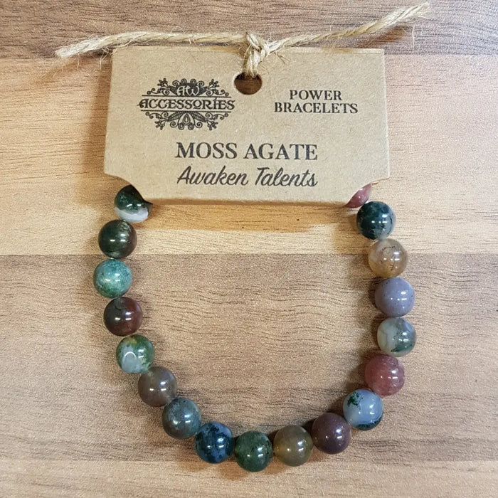 A colorful moss agate gemstone bracelet with round polished beads in green blue brown and purple for mood stone use